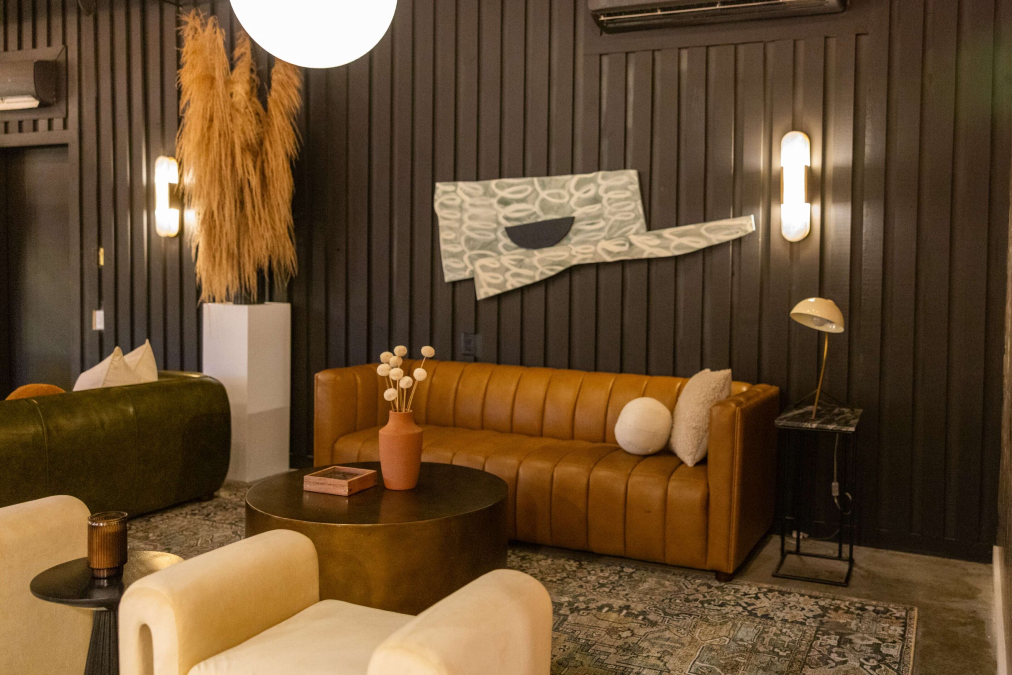 Cozy living room with a brown leather sofa and modern decor.