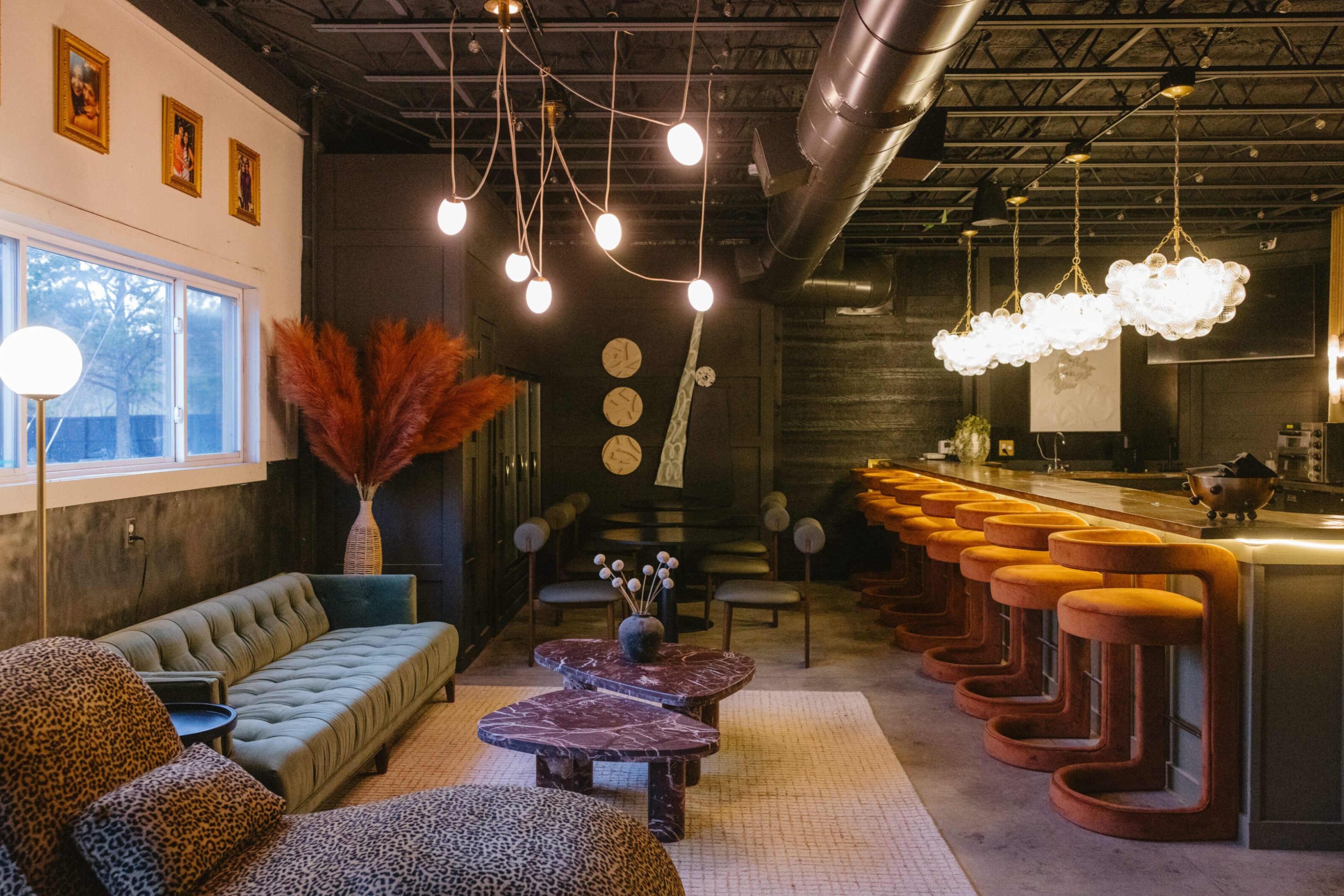 Cozy modern lounge with stylish lighting and seating.