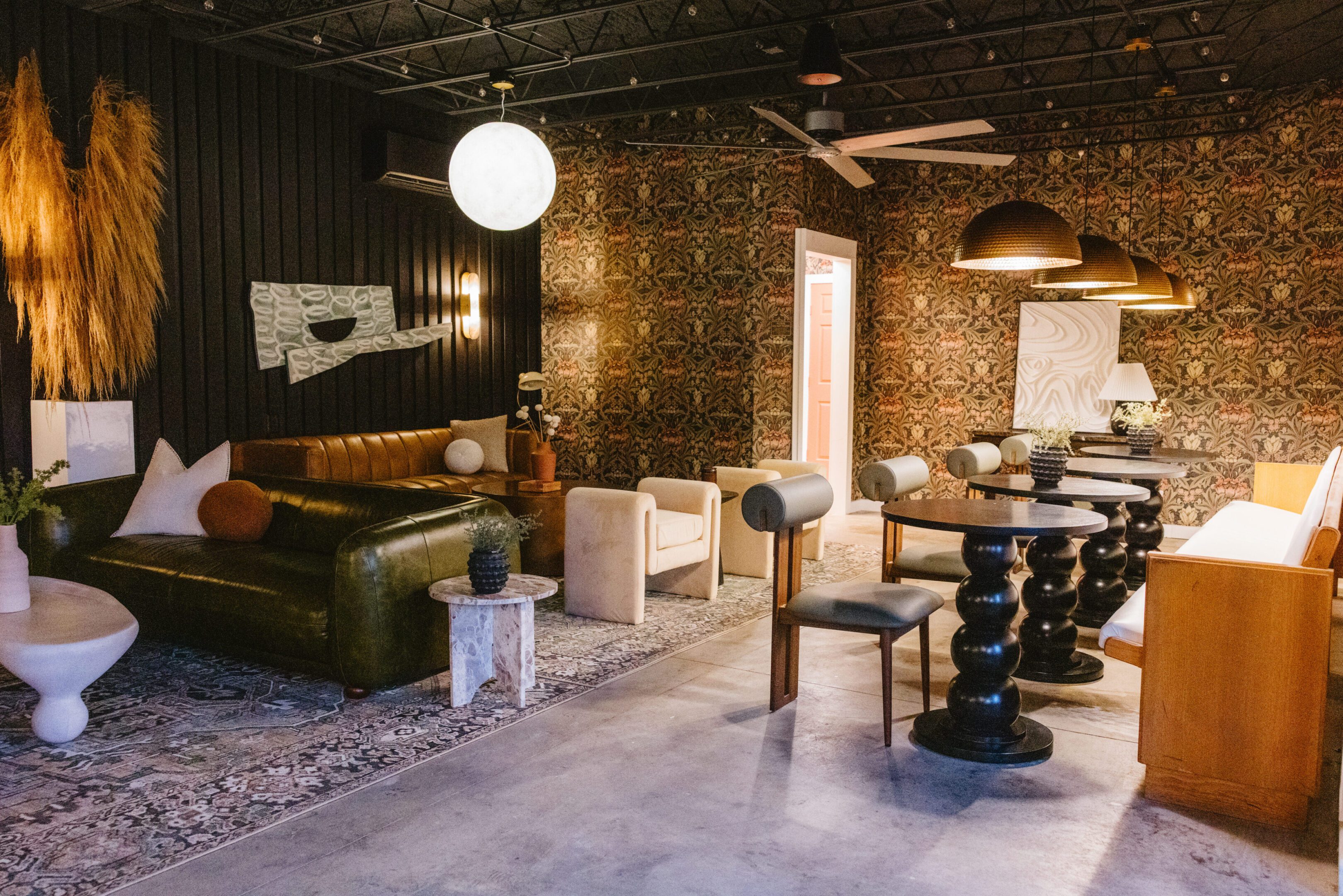 Cozy lounge area with eclectic furniture and warm lighting.