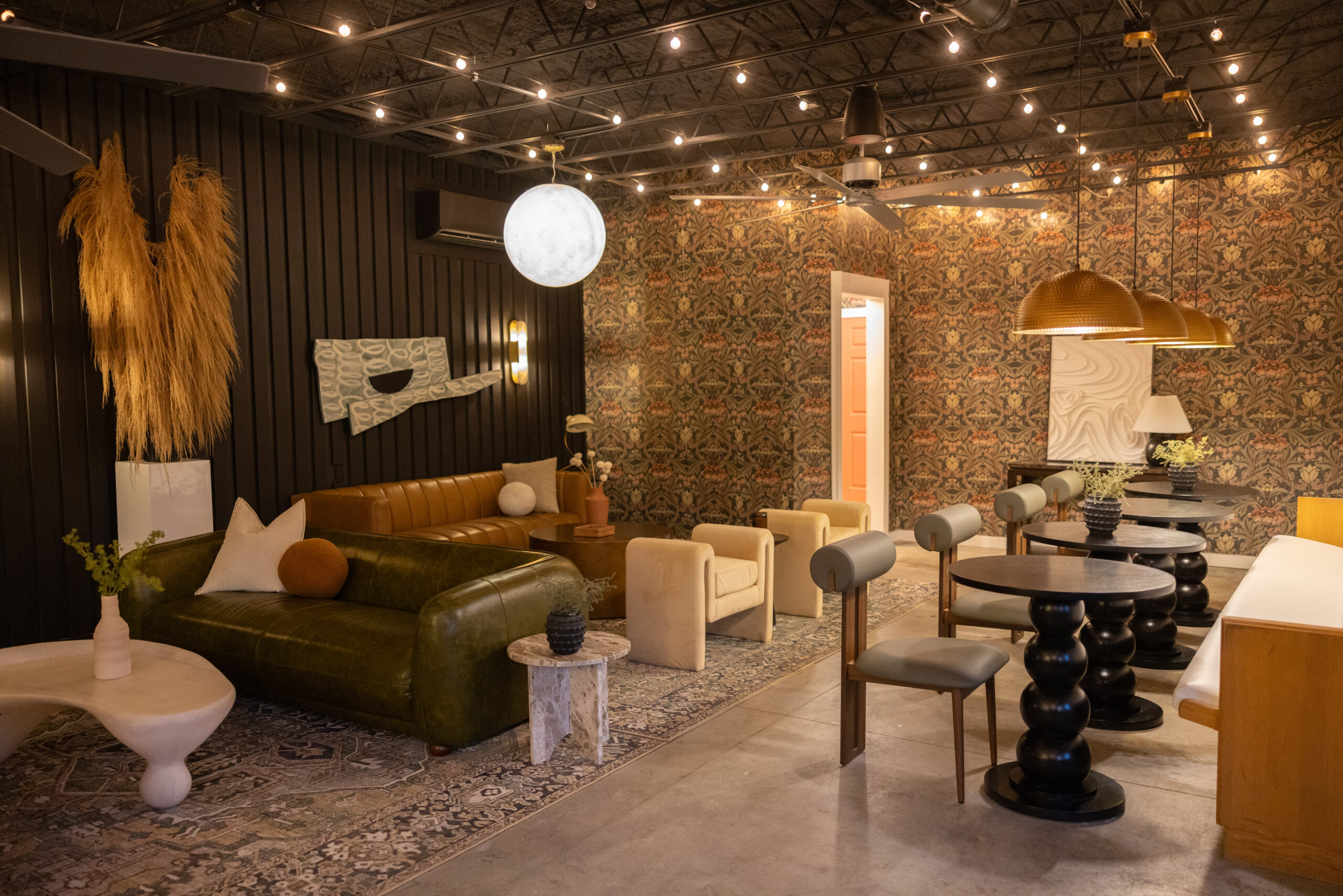 Cozy modern living room with warm lighting and stylish furniture.