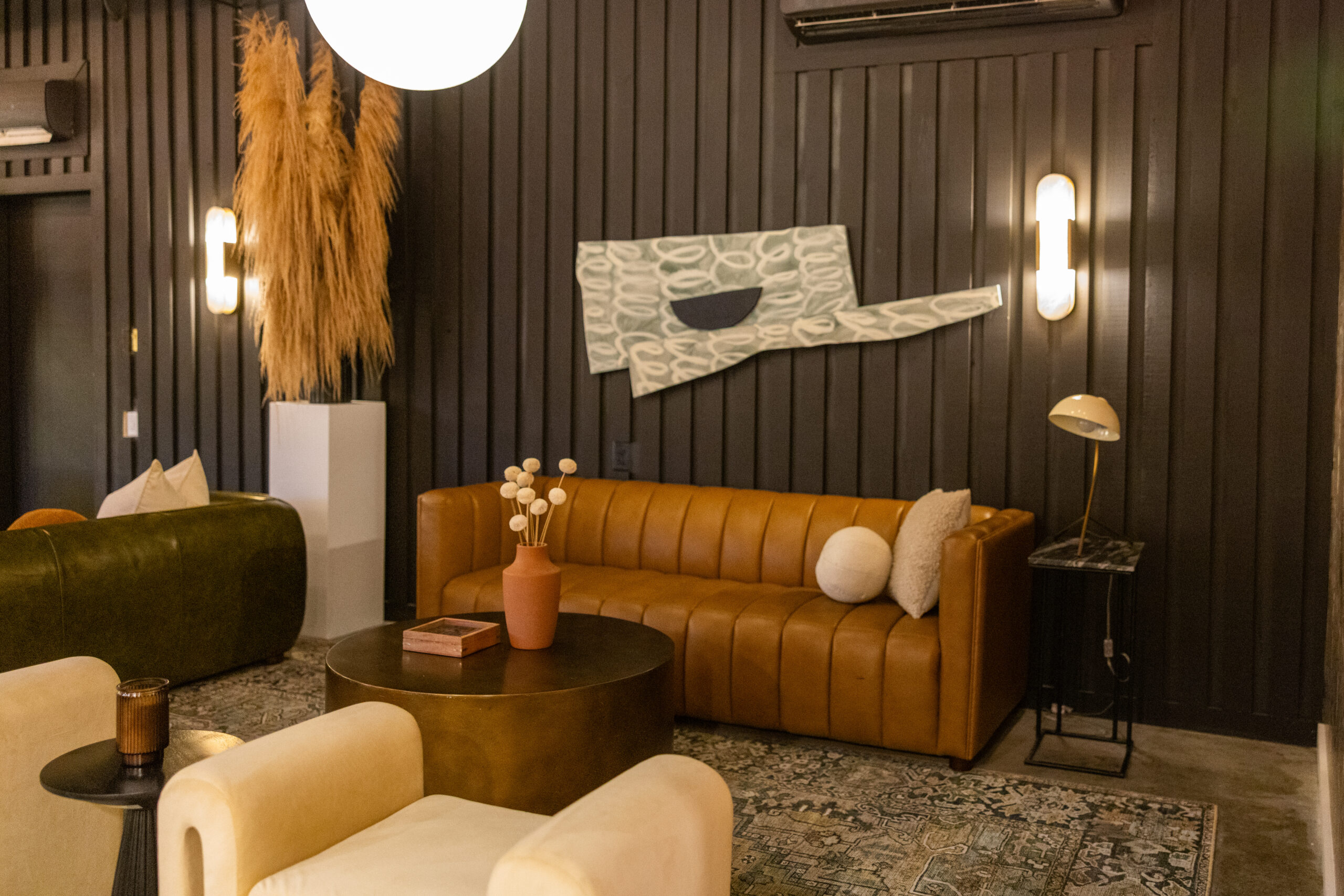 Cozy living room with a brown leather sofa and modern decor.
